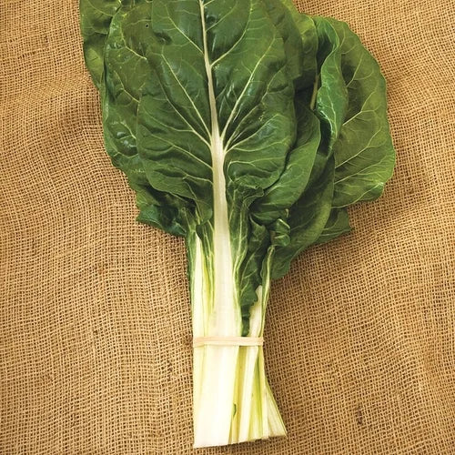 Bunch of green leafy vegetables tied together on a textured brown background