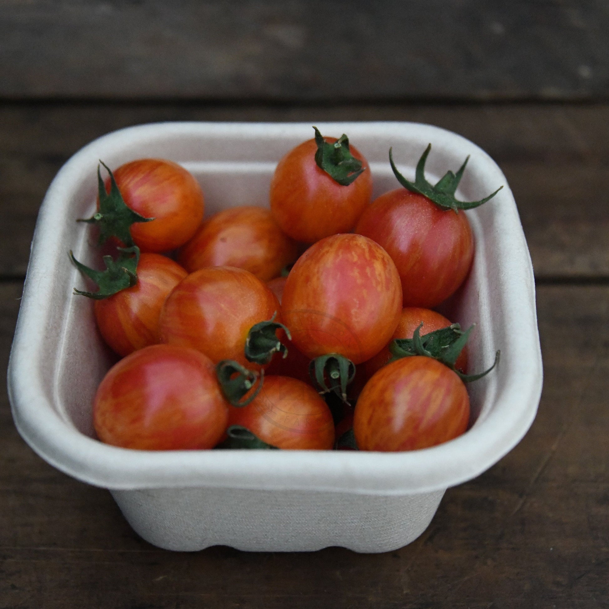 cherry tomatoes in small crate